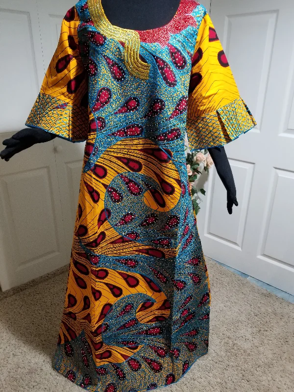 Lateast Nigerian Ankara-dress. Ankara-kaftan Full lenght embriodered and embellished with all over shinning crystal stones to perfection. 63inch full lenght. This is a 44 inches Burst size. Have room on the inside for adjustment