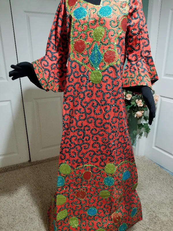 Lateast Nigerian Ankara dress,  Ankara-kaftan Full lenght embriodered and embellished with all over shinning crystal stones to perfection. 63inch full lenght. This is a 44 inches Burst size. Have room on the inside for adjustment